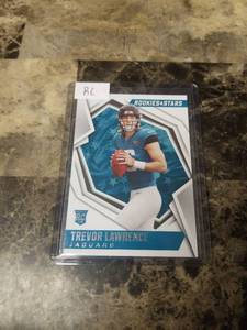 lot 994 image: 2021 Panini Rookies and Stars Football Trevor Lawrence Jacksonville Jaguars Rookie Card