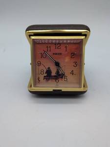lot 16834 image: Vintage Equity Folding Travel Alarm Clock with Fishing Scene