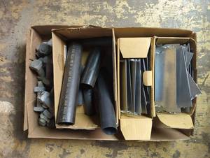 lot 16737 image: Mixed lot of bulk Industrial items - Metal PlatesFlashingTrim pieces, black tubing, and bolts with nuts
