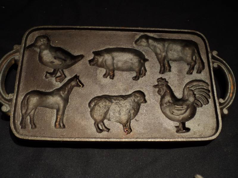 lot 3187 image: (1) clot cast iron muffin pan,  farm animals