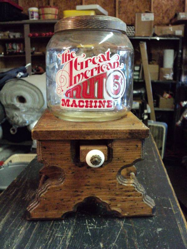 lot 3225 image: The Great American Nut Machine jar with wooden stand