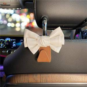 lot 6654 image: LIFOPY 2 Pack Car Purse Hooks, Cute Bow Car Seat Headrest Hook Hanger for Purses and Bags, Space-Saving Car Accessory (White brown)
