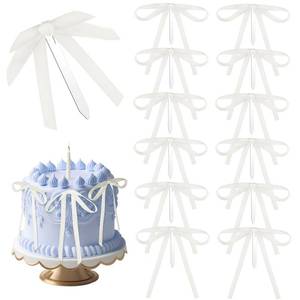 lot 6693 image: Teenyyou 12 Pcs Ivory White Bow Ribbon Cake Toppers 5 x 7 Inches Satin Bow Cake Toppers Coquette Party Decorations for Wedding Bridal Gender Reveal Baby Shower Bachelorette Party Supplies