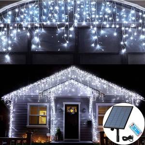 lot 6801 image: KiflyTooin Solar Christmas Lights Outdoor Waterproof Christmas Decorations Curtain Lights 320LED 29.5ft 60 Drops, Solar Powered Rechargeable Fairy Lights for Party, Wedding, Home Decorations(White)
