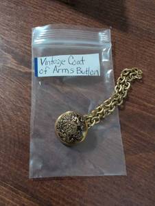 lot 2486 image: Decorative Military Coat of Arms Button with Chain
