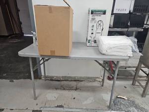 lot 15152 image: Chapin 2-Gal Lawn &amp Garden Sprayer, Folding Table, Stretch Film, Disposable Clothing Protection