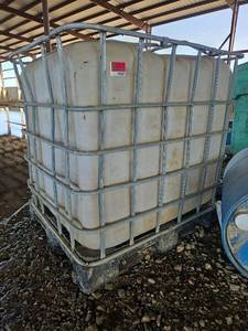 lot 19347 image: 275 Gallon IBC Tote Tank with Metal Cage