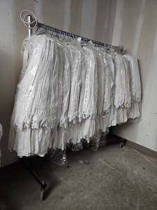 lot 15820 image: Commercial Clothing Rack W Bulk Lot of Lab Coats