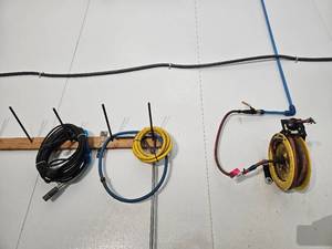 lot 15869 image: Industrial Cable Reel Storage Rack with Cables