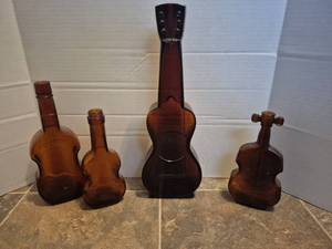 lot 28498 image: Amber Glass Violin Bottle Collection
