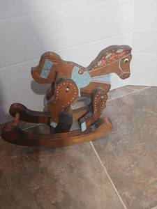 lot 28585 image: Wooden Rocking Horse with Blue and Coral Decorations