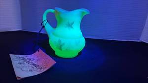 lot 12 image: Fenton UV reactive painted pitcher with a Burmese treatment