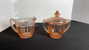 lot 44 image: Adam pink depression glass creamer and sugar set