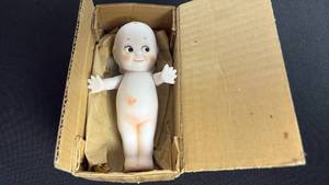lot 70 image: Vintage Shackman bisque pudgy, Kewpie doll with box