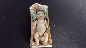 lot 74 image: Antique bisque porcelain doll approximately 4 inches