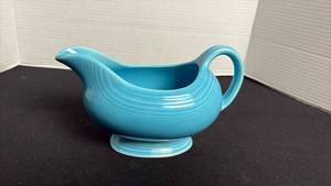 lot 90 image: Fiesta wear gravy boat