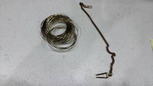 lot 259 image: Lapel clasp and stack of bangles