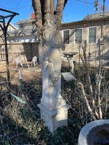 lot 338 image: Concrete garden statue of a woman, often referred to as a harvest or autumn statue. Approximately 88 x 18 x 18 in VERY HEAVY will need help and equipment to remove. Easy alley to backyard access.
