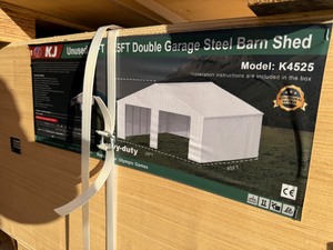 lot 2245 image: Unused KJ Metal K4525G  45x25x14 Double Garage in Cream - Walk through door only