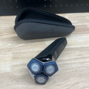 lot 956 image: Philips Norelco Shaver 7100, Rechargeable Wet & Dry Electric Shaver with SenseIQ Technology and Pop-up Trimmer for Male. New and Powers on but No charging Cable - Retail $149