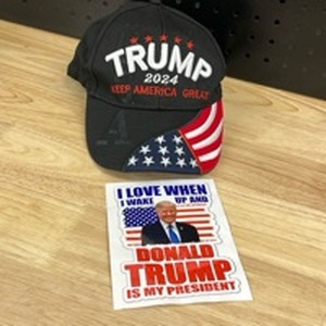 lot 1031 image: Donald Trump Hat and Sticker - Retail $0