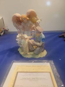 lot 5209 image: Seraphim Classics Caring Touch Angel with Policeman Figurine #81776 with COA new in box
