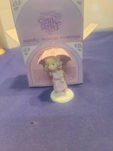 lot 5353 image: Precious Moments Girl with Umbrella Figurine