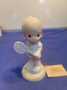 lot 5507 image: Precious Moments Tennis Player Figurine Serving The Lord (1985)