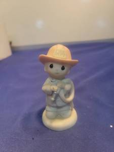 lot 5642 image: Precious Moments You Set My Heart Ablaze Firefighter Figurine