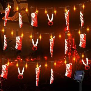 lot 13180 image: Halloween Solar String Lights with Fake Knife, 16.4FT and 50 Orange LEDs Outdoor Halloween Decorations with 16 Fake Hanging Bloody Knives for Outside, Porch, Horror Movie Party, Haunted House Decor
