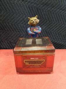 lot 3703 image: AMC Guardians of the Galaxy Vol. 3 ROCKET RACCOON POPCORN TIN FIGURE IN HAND