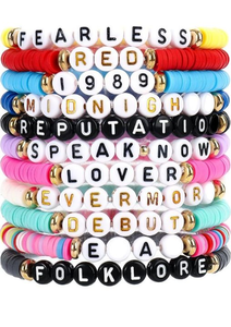 lot 738 image: Taylor Swift Album Title Beaded Bracelets Set (13 Piece)