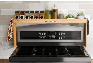 lot 16976 image: Bamboo Over the Stove Spice Shelf for Kitchen Storage, 31.5 Spice Rack Organizer Stove Top Shelf - Retail $0
