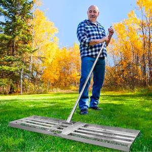 lot 17043 image: Exceptional Lawn Leveling Rake 36 Inch - 304 Stainless Steel Heavy Duty Lawn Leveler - Max-Strength 76 Inch Extra Long Pole - Yard Leveling Rake for Crafting Flawless Lawns - Reach Further Areas - Retail $119