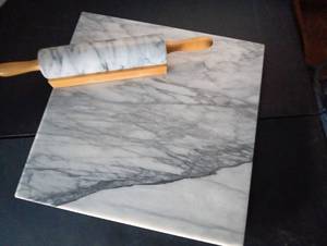 lot 304 image: Marble cutting board 18x18 wrolling pin