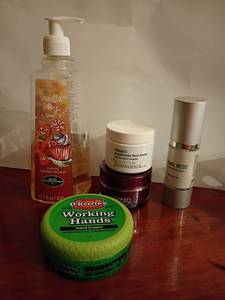 lot 604 image: Hand soap, neck cream, face serum and hand cream