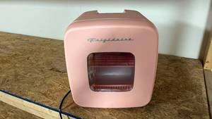 lot 900 image: Working Frigidaire Pink Mini Fridge EFMIS351