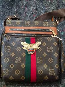 lot 5 image: Designer Monogram Crossbody Bag with Bee Brooch