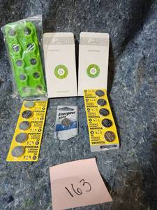 lot 63 image: RavPower Battery Charging Kit with CR2032 Batteries