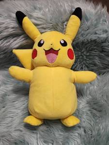 Official Pokemon Pikachu Plush with Brown Bow- Animated Takes 4 Double A Batteries, Not Included