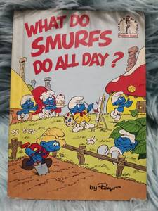 lot 105 image: What Do Smurfs Do All Day - 1983 Beginner Book by Peyo