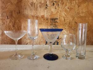 lot 12552 image: Assorted Glassware Lot Including Champagne Flutes, Martini Glasses, and Wine Glasses