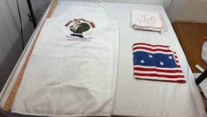 lot 37 image: White Apron with Christmas Santa & assorted fabric