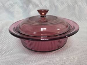 lot 21 image: Corning Vision Cranberry Glass Casserole Dish with Lid