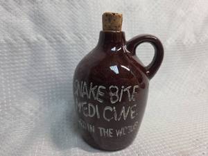 lot 55 image: Snake Bite Medicine Jug