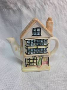 lot 131 image: Tea Shop House Ceramic Teapot
