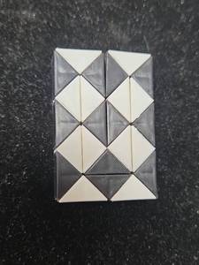 lot 178 image: Rubiks Snake Twist Puzzle Black and White