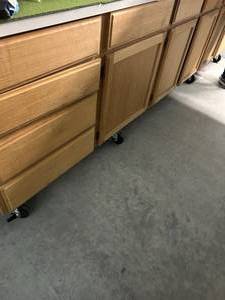 Solid Wood Cabinet on casters approx 8 ft long