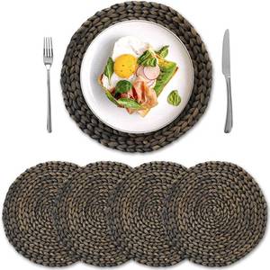 lot 40003 image: Round Woven Placemats Set of 4, Natural Water Hyacinth Place Mats, Boho Wicker Placemats, Table Mats for Dining Table (13.8 inch) Black by YANGQIHOME - Retail $25