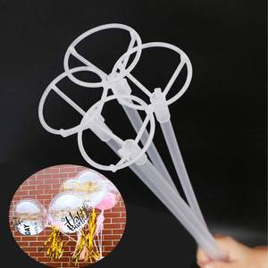 lot 51773 image: 20 Packs Balloon Sticks, 27 Long Large Balloon Stands Holders with Base for Table Desktop Centerpieces - Retail $13